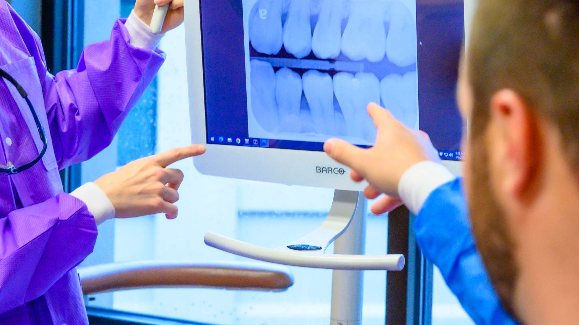 Prosthodontist Dr. Shelby Alexander works with residents in her advanced education program.